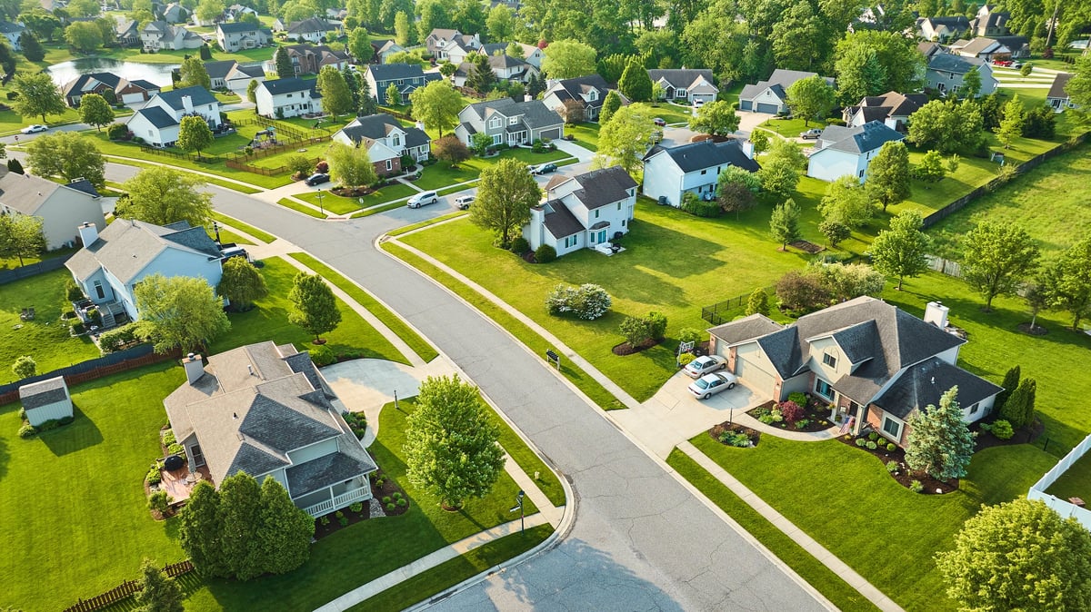 Suburban home with fresh landscaping and tile roof