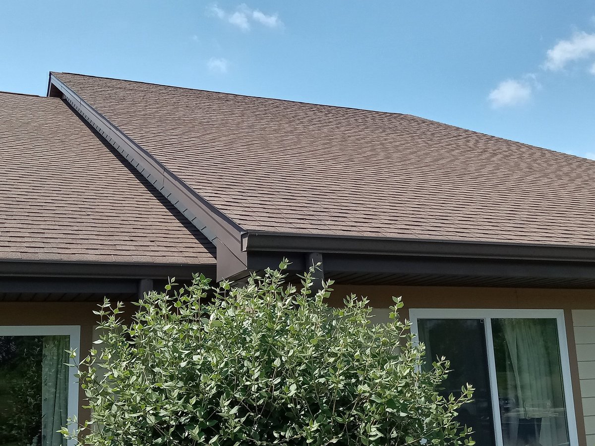 New tile roof installation in progress on residential home